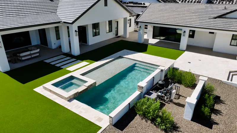 Aerial of a new pool and spa beside the house, filmed by Maken Media